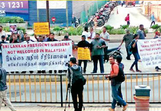 Tamil Diaspora activists protest opposite the hotel where Maithriplala was lodging in Malaysia Tamil Diaspora activists protest opposite the hotel where Maithriplala was lodging in Malaysia