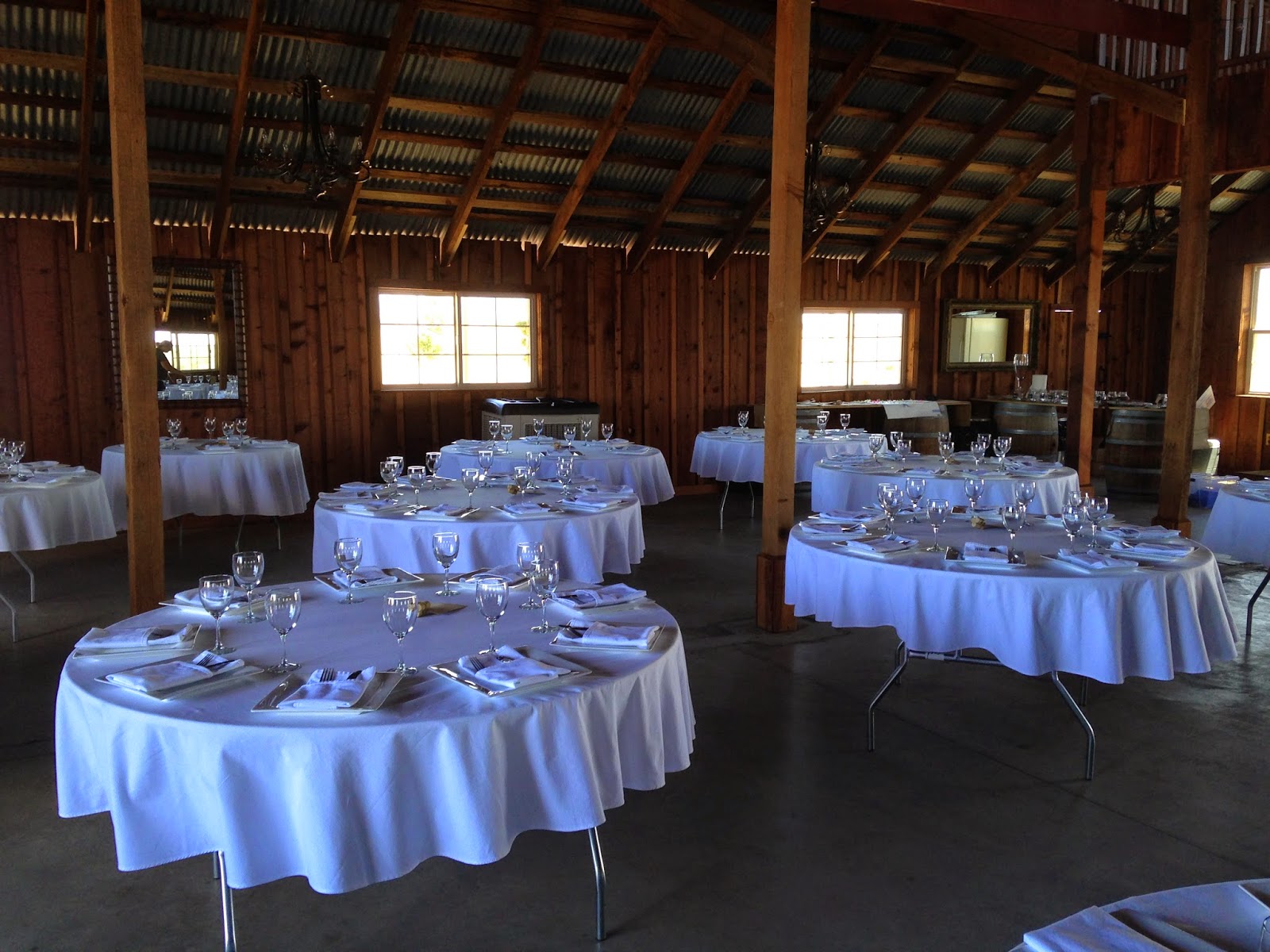 Table settings in a barn for a wedding in California Table settings in a barn for a wedding in California
