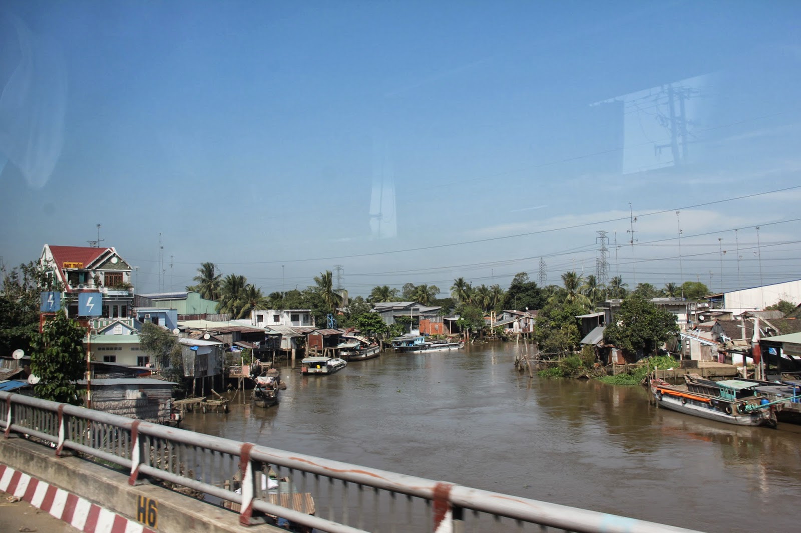 View from a bridge over one of the branches of the Mekong River. View from a bridge over one of the branches of the Mekong River.