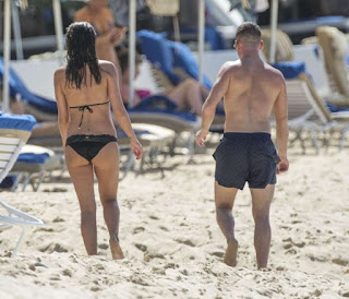  The stunning brunette, Danielle Lloyd, 31, enjoyed her free schedule in a black bikini on Friday, December 11, 2015 as she spent the most romantic holiday with new boyfriend, Michael O'Neill at the beach in Barbados.