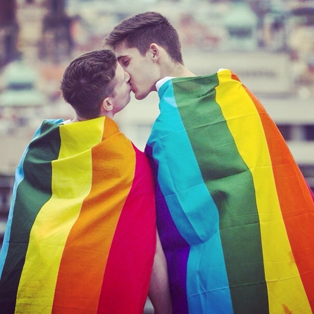 Rainbow flag gay kiss.