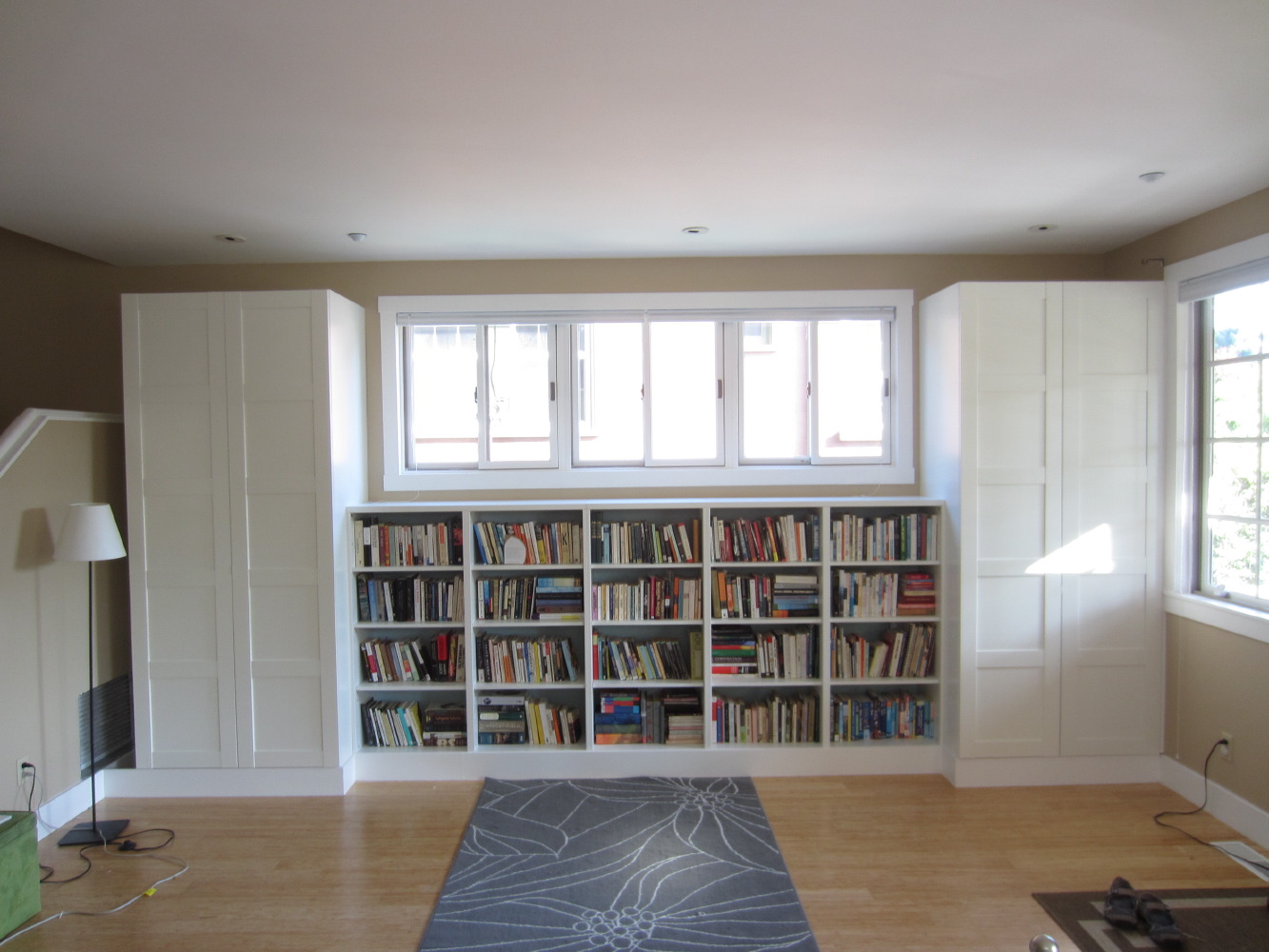 Living room builtin bookshelves and closets using BESTA shelves and
