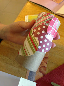 covering a toilet paper tube with paper hearts