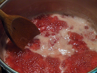 Pan of bubbly foamy strawberry syrup