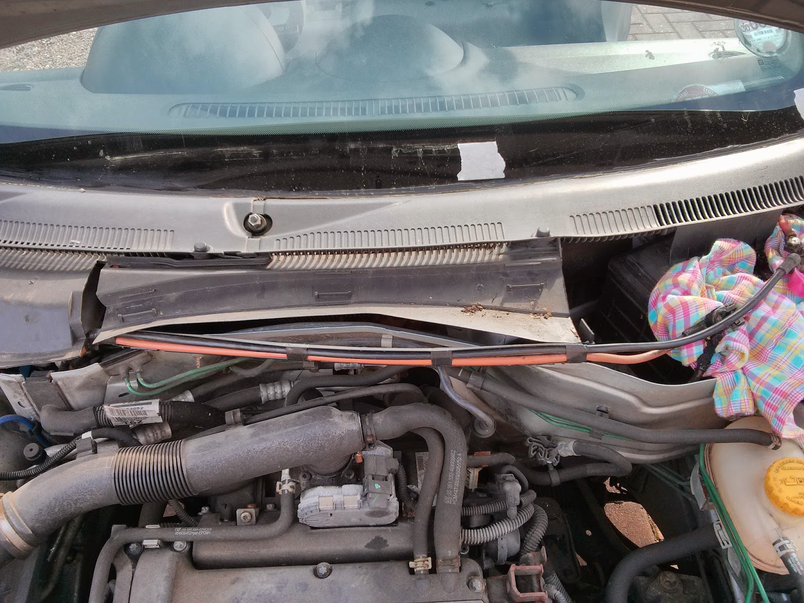 unclip battery wires from scuttle panel * lift up scuttle slightly where the rubber seal went across the width of the engine bay.