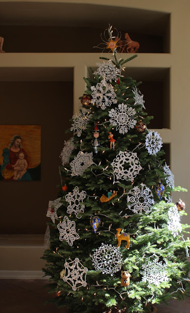 The Christmas Tree, Sarah Myers Christmas, holiday, tree, snowflakes, decorations, decor, noel, navidad, winter, lights, sparkle, ornament, camel, angel, star, sheep, soldier, figures, Christmastime, Weihnachten, interior, decor, art, handmade, joy, happiness, ornate, beautiful, handiwork, charm, photography, Sarah Myers, glass, fir, live, paper, cut, designs, gold, red, blue, green