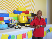 My little guy posing with his Lego Ninjago dessert table.oops Zane's head .