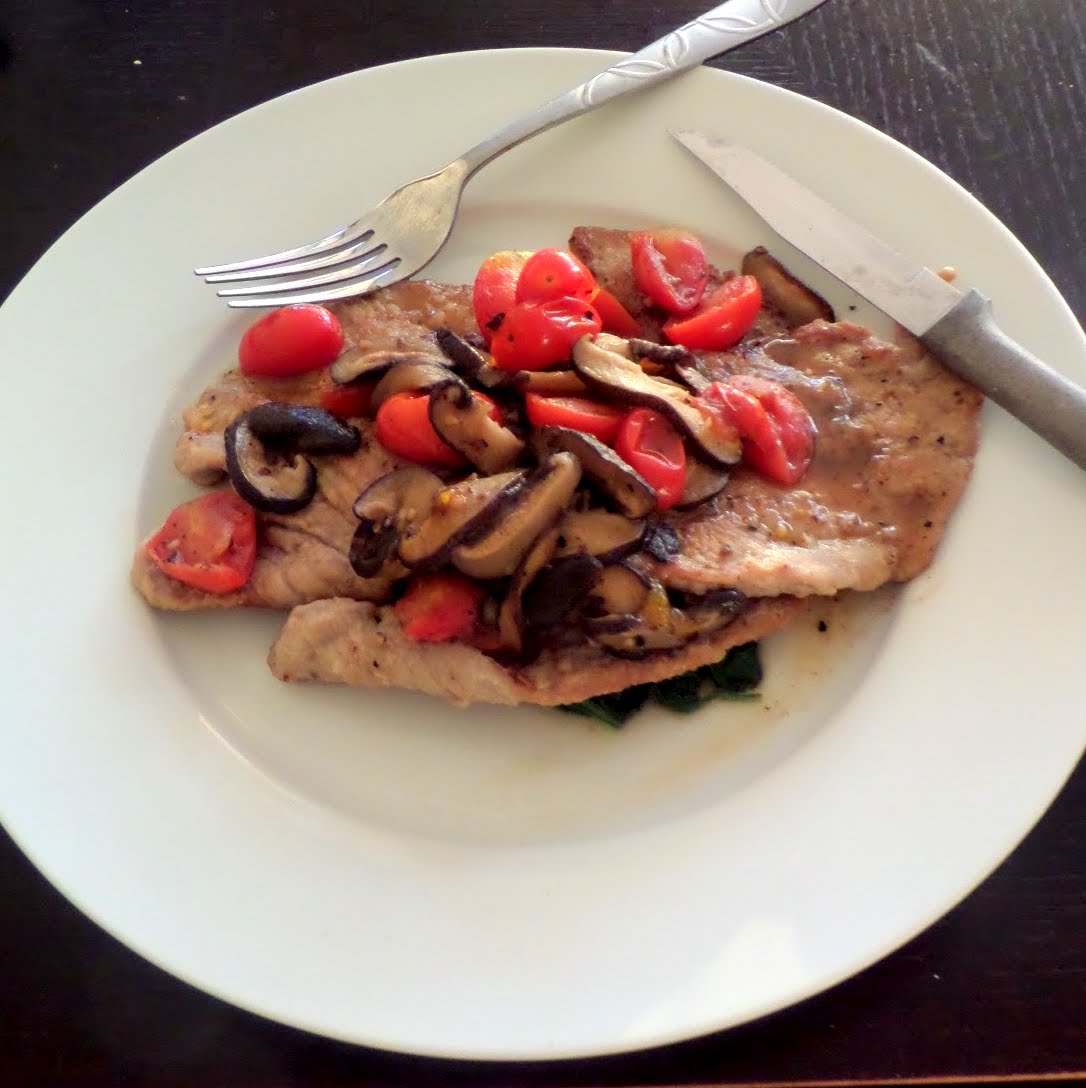 Veal Scallopini:  thin veal cutlets with tomatoes, mushrooms, and spinach in a white wine sauce.