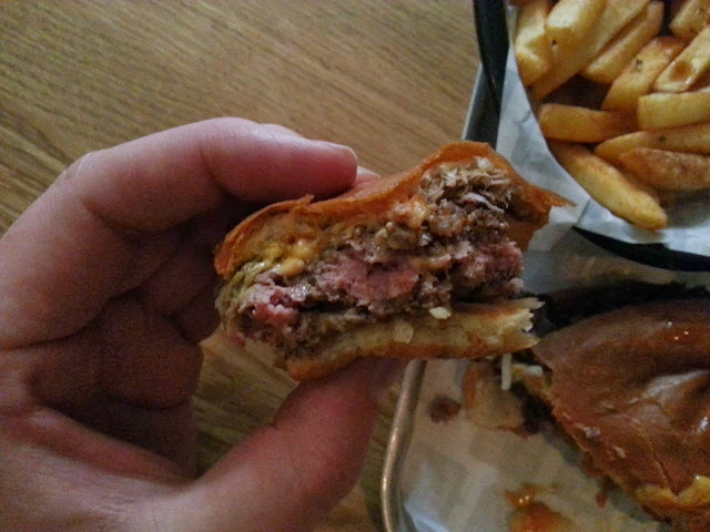 Medium-rare bacon cheese burger from Dip & Flip