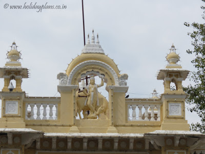 Lord Krishna architecture at the entrance gate Lord Krishna architecture at the entrance gate of Mysore palace