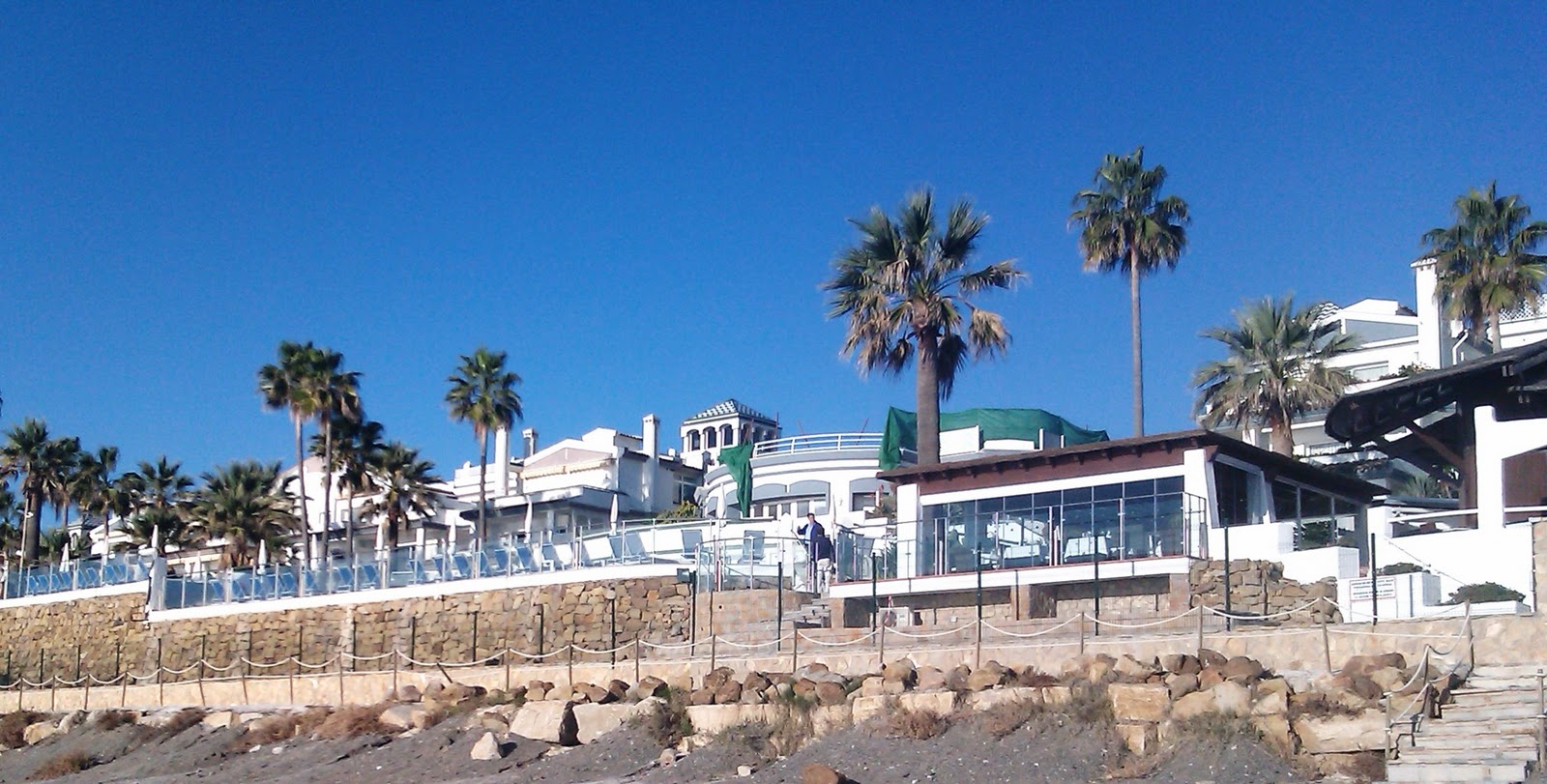 HomeCare Estepona View of Dominion Beach restaurant and beach pool