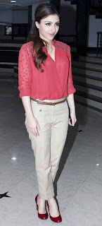 Soha sports a casul chic look in beige pants, coral shirt colour block pumps.