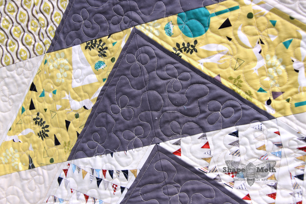 Shape Moth 'Hillside' lap quilt