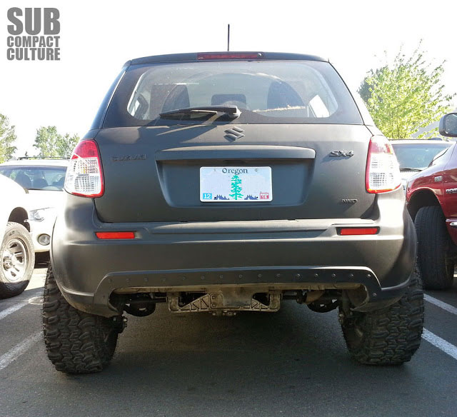 Back end of the most evil looking Suzuki SX4 ever