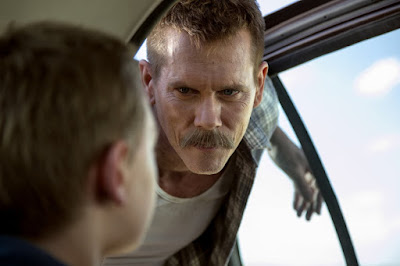 Image of Kevin Bacon in Cop Car