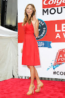 Stacy Keibler  red dress waveing to cameras