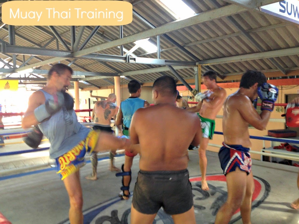 Why Muay Thai is Popular Martial Art Sport in Thailand? a group of men training Muay Thai martial arts