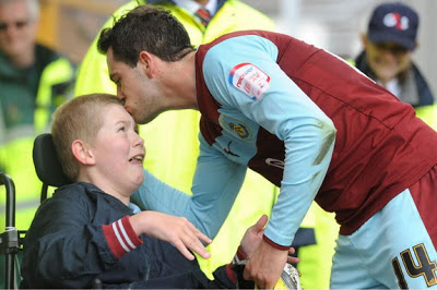 Burnley player give his boots to disabled fan