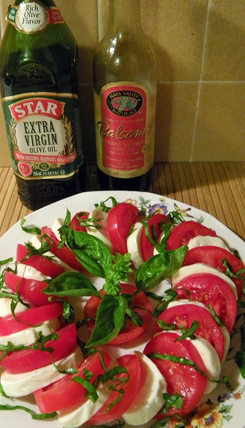 Salad with Bottles of Olive Oil and Balsamic Vinegar