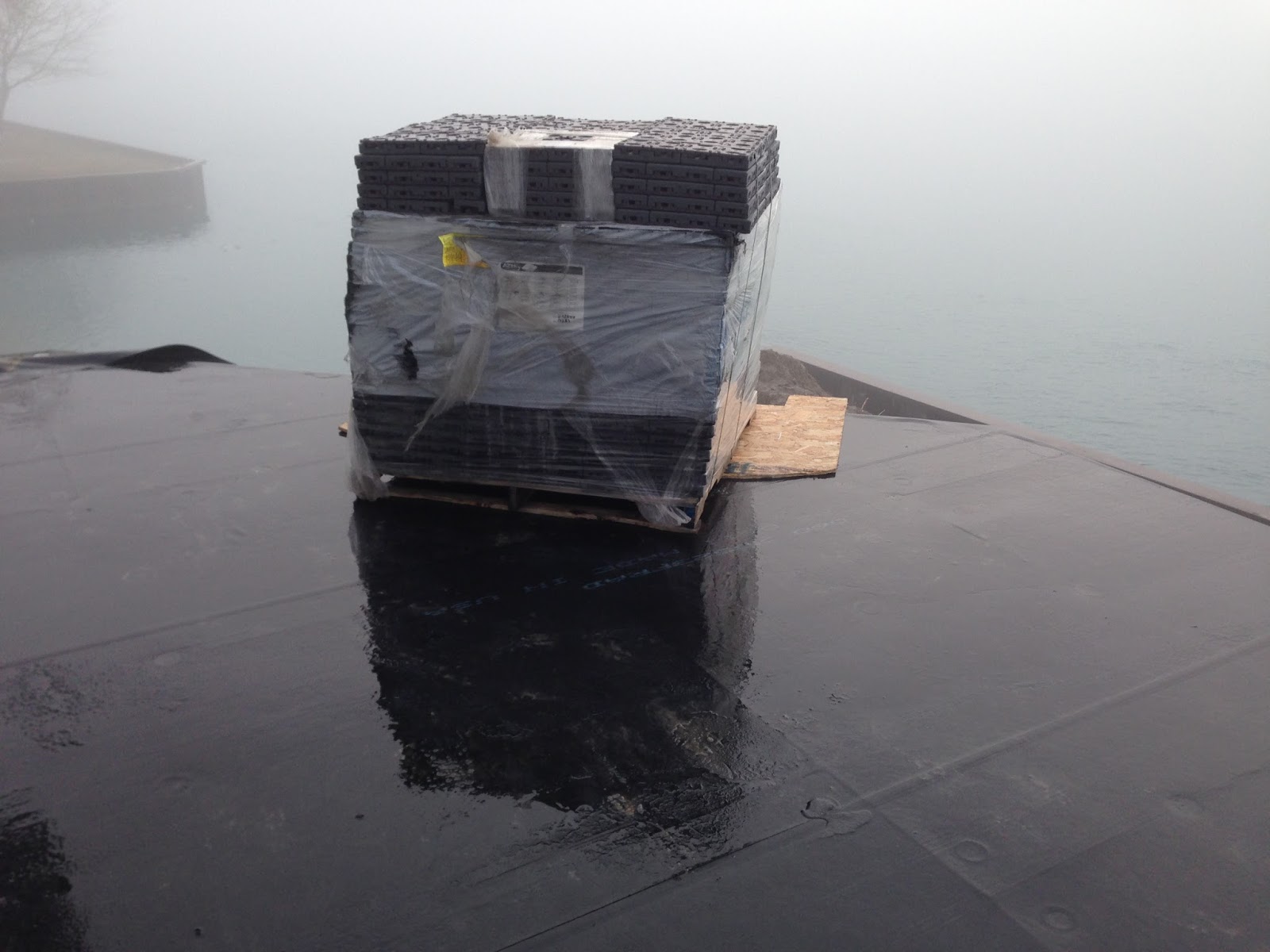 Outdoor Living Low sloped roof decks, composite pavers and cable rail.