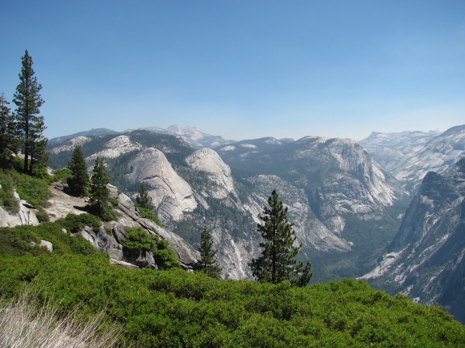 The Rest of the Valley The Yosemite Valley stretches away in the view from the top of Glacier Point at Yosemite National Park, California