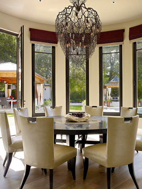 Black Round Dining Tables for Various Dining Room Designs Cozy Dining Room with the Wide Unique Chandelier and Round Dining Tables on the Hardwood Floor