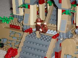 LEGO Indiana Jones standing on some steps.