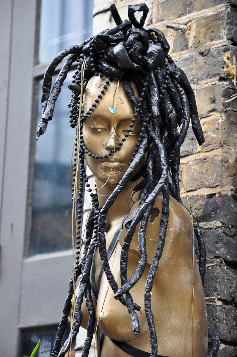 A mannequin outside of an alternative hairdresser's, Stables Market, Camden Town, London, England