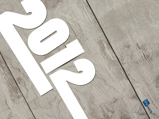 2012 White Text on Wood Texture HD Wallpaper