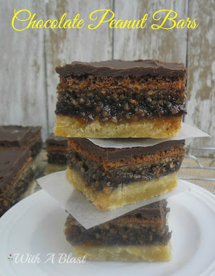 Gooey Chocolate Peanut Bars ~ Layers of pure delight ~ cookie crust with a gooey chocolate/peanut filling and topped with a rich chocolate icing #SweetTreats #PartySnacks #Desserts #PeanutBars www.WithABlast.net
