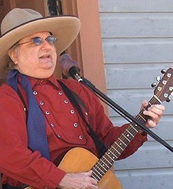Western Cowboy Singer and Yodeler, Lonesome Ron, Buys Cabin in Exchange for Giving Guitar Lessons