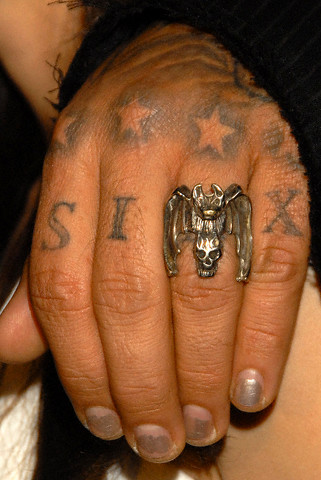 Several small black stars tattoo on pretty girl's face Several small black stars tattoo on pretty girl's face