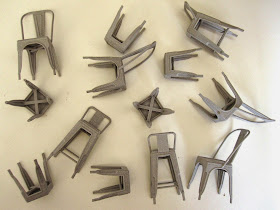 Selection of modern dolls' house miniature 3D-printed cafe chairs and stools.
