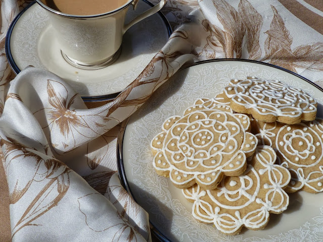 coffee and hand-decorated lemon-rosemary tea biscuits with silk scarf