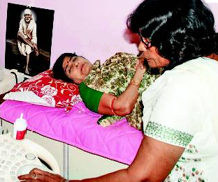 Kanakalata Ram having an ultrasound