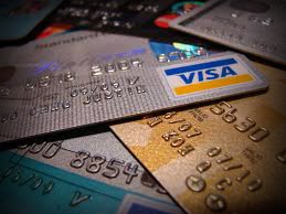 Is the consumer-borrowing party getting louder out of happiness or desperation? Consumers are broke. Credit cards are readily available. Consumers are thus using what is available to satisfy basic needs. Image of multiple credit cards over a flat surface