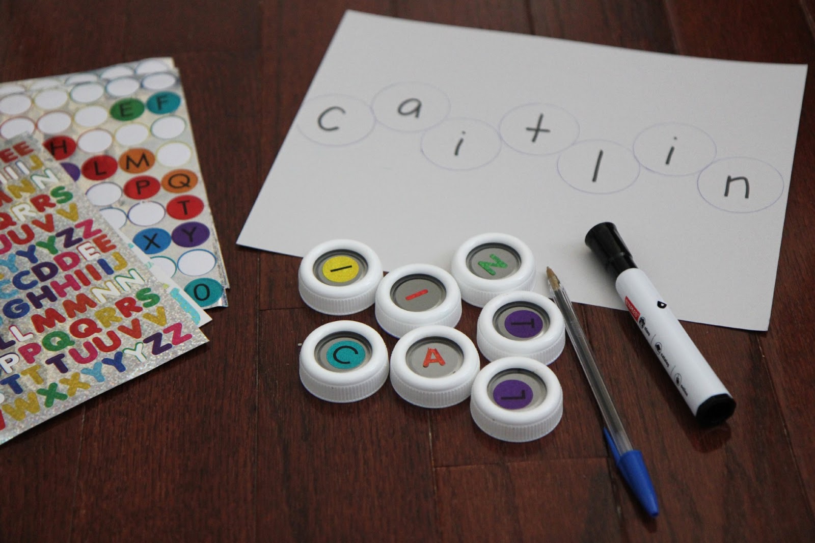 Toddler Approved! Little Learners Bottle Cap Name Matching