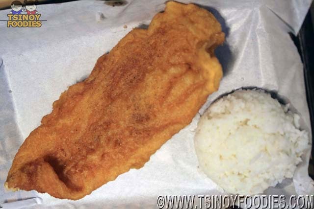 large crispy fish with rice and drink
