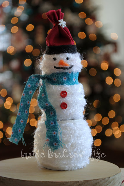 Use wooden spools to create this easy Yarn Snowman