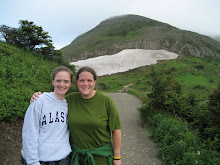 Me and Beth in front of snow on Flat Top hike