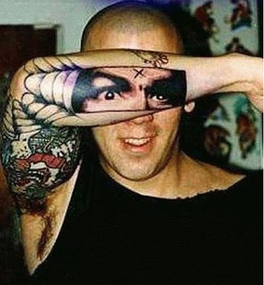 Creative Tattoo of his face on face tattoo. Creative Tattoo of his face on