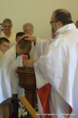Child being baptised.