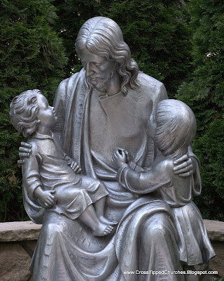 Day shot of statue of Jesus holding children