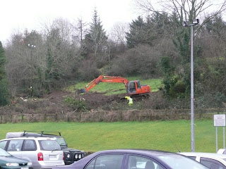 Lads & digger behind the car park