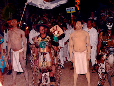 Mayan leaders head up the procession of villagers attending the opening Mayan leaders head up the procession of villagers attending the opening