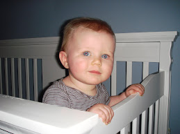 Loves standing in his crib