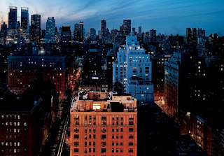 The lit-up duplex penthouse apartment of Bernie and Ruth Madoff, on East 64th Street, foreground, where he is under house arrest. Photograph by Stephen Wilkes, Vanity Fair