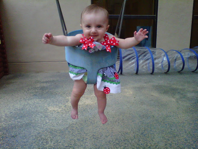 Lilly in her swing at Day School