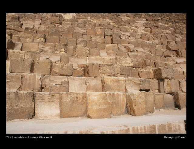 The three pyramids - Khufu's (Cheops), his son Khafre's and Menkaure's. These along with the Sphinx, the funerary temples and the minor pyramids of their queens had completed the entire pyramid complex at Giza or El-Giza.