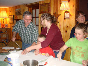 Joel and Abi assisting Ash and Isaac with making Lefse
